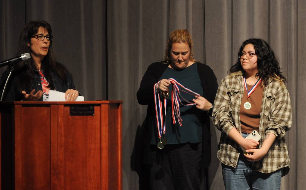 Anita Benitez, world languages teacher at Sequim High School (left), and SHS assistant principal Erin Fox congratulate SHS senior Kenya Salada for her work to pass the Seal of Biliteracy exam at the SHS scholarship awards ceremony on June 1. Sequim Gazette photo by Michael Dashiell