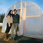 Photo courtesy of Tampopo Farm
Teresa Shiraishi and Matt Rohanna stand outside their greenhouse at Tampopo Farm.