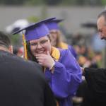 Sequim High School graduating senior Abigail Carlson shares a lighthearted moment with SHS principal Shawn Langston, right, at SHSs Class of 2022 graduation.