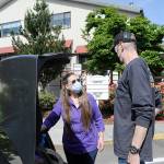 Sequim Gazette photo by Matthew Nash/ Tom Riggle of Sequim makes a donation to the Serenity Thrift Store with employee Julie Ruple last week. Staff report donations and sales are close to pre-pandemic levels but theyve seen a rise in crimes like thefts and illegal dumping costing them thousands.