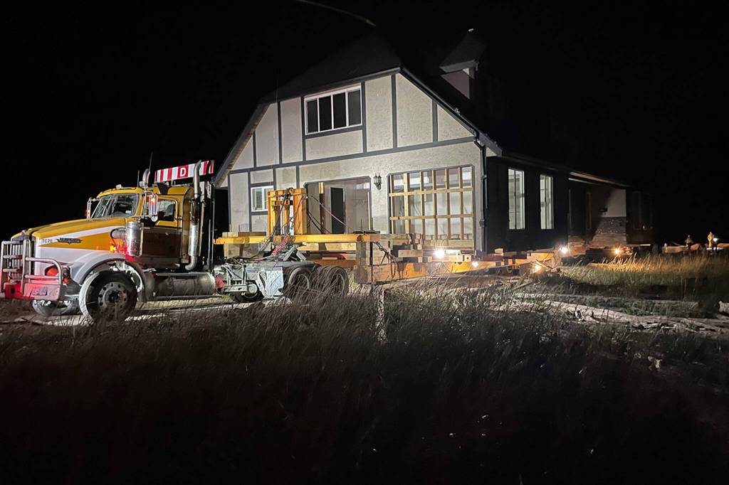 Sequim Gazette photo by Matthew Nash
Nickel Bros crews began unloading a 4,000-square-feet house around 11:30 p.m. June 8 in Dungeness after they awaited high tide.