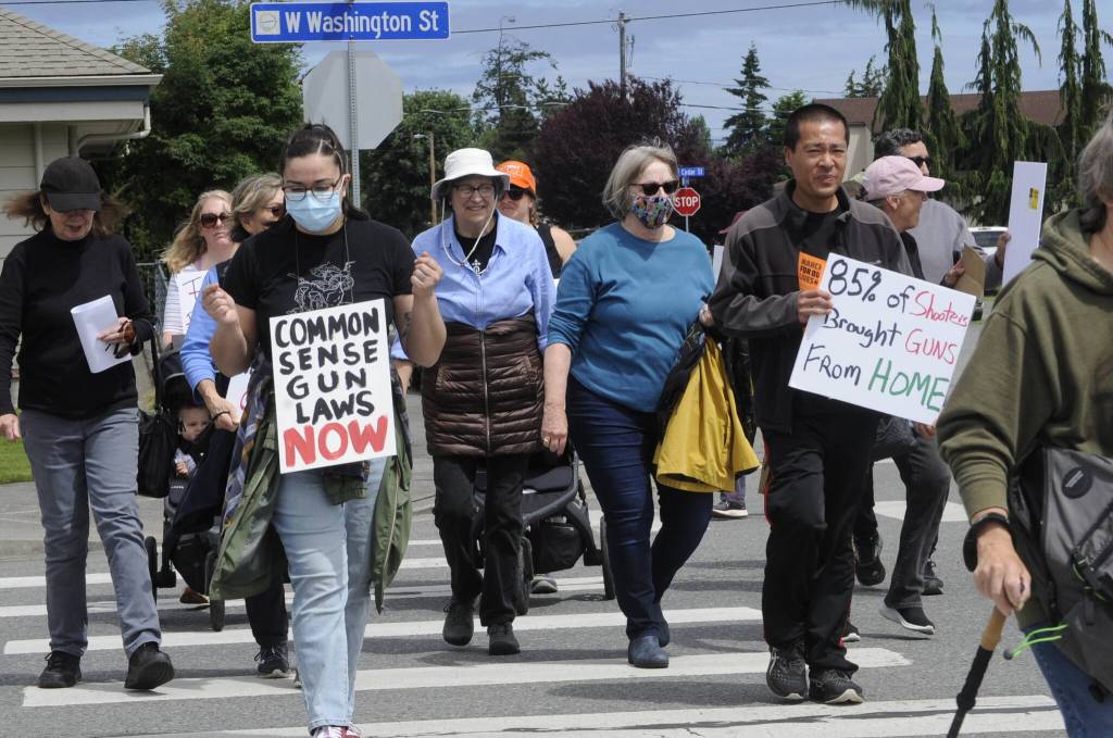 Sequim Gazette photo by Matthew Nash
Annie Benavidez of Sequim holds a sign reading Common sense gun laws now during the Sequim March for Our Lives event on June 11. She said shes tired of hearing about dead children just wanting to go to school.