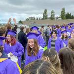 Sequim Gazette photo by Matthew Nash/ About 175 Sequim High seniors walk one lap on the morning of June 10 to be congratulated by students and staff from Sequims other schools.