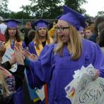 Sequim Gazette photos by Matthew Nash
Cassidy Crecelius, a Sequim High senior, shares in excitement for graduation day with a friend during the 2022 Grad Walk on Sequim School Districts track.