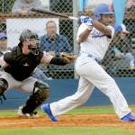 Keith Thorpe/Peninsula Daily News
Lefties' Golden Tate hits into an RBI double as Bend catcher Isah Burk looks on during the first inning on Tuesday evening at Port Angeles Civic Field.