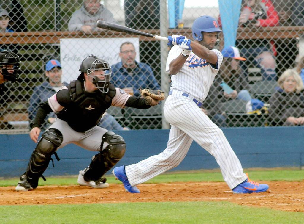 Golden Tate lines an RBI double to right field in his first at-bat as a Lefties player as Bend catcher Isaiah Burke looks on during the first inning on June 14 at Port Angeles Civic Field. Photo by Keith Thorpe/Olympic Peninsula News Group
