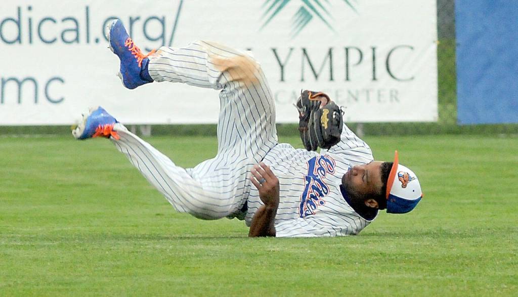 Lefties center fielder Golden Tate rolls on the ground after making a diving catch in the top of the third to end Bends half of the inning on June 14 in Port Angeles. Photo by Keith Thorpe/Olympic Peninsula News Group