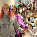 Sequim Gazette photo by Matthew Nash/ Fifth graders from Aaron Renos class at Greywolf Elementary Elias Shinkle, Corbin Strawn, Brooklyn Sorensen, Mylie Johnson and many more walk the halls as schoolmates from other grades cheer for them on June 16.