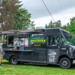 Sequim Gazette photo by Emily Matthiessen
Jay Pederson, a full-time RV traveler, discusses the menu with Caleb Messinger at the Southern Nibble food truck, parked at the John Wayne Marina Resort on the outskirts of Sequim.