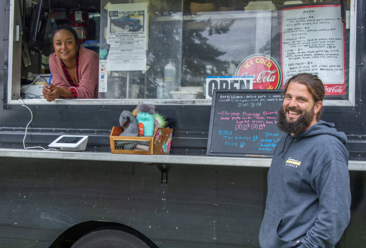 Charmaine and Caleb Messinger enjoy each others company as they operate the Southern Nibble, a South Carolina Lowland style food truck which serves food in locations around Sequim and Port Angeles. Gazette photo by Emily Matthiessen