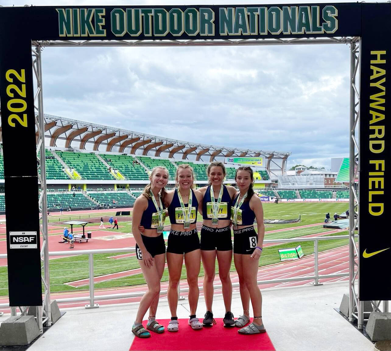 Submitted photoS
Sequim TC members (from left) Hiilei Robinson, Riley Pyeatt, Eve Mavy and Kaitlyn Bloomenrader celebrate an Emerging Elite championship at the 2022 Nike Outdoor Nationals at the University of Oregons Hayward Field in Eugene, Ore., on June 18.