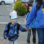 Teacher Tracy DeLorm walks first-grader Raylan Coler to the bus as he sports his Last Day of School crown at Helen Haller Elementary. Most of Sequim School Districts schools finished classes on June 17 for summer break.