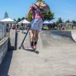 Preston Kurtz does a trick with his scooter on a quarter pipe at Carrie Blake skatepark on Saturdayd during the Sequim Youth Skatepark Foundations fundraiser. Sequim Gazette photo by Emily Matthiessen