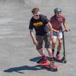 Skateboard versus scooter race between the winners of the skateboard and scooter races, Aaron Schultz and Preston Kurtz, at Saturdays fundraiser for the Carrie Blake Skate park. Sequim Gazette photo by Emily Matthiessen