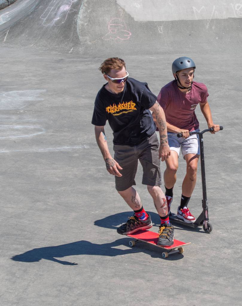 Skateboard versus scooter race between the winners of the skateboard and scooter races, Aaron Schultz and Preston Kurtz, at Saturdays fundraiser for the Carrie Blake Skate park. Sequim Gazette photo by Emily Matthiessen