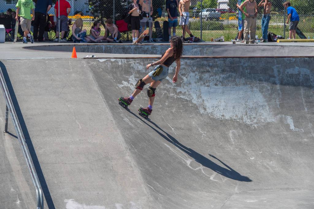Jes Broder played, competed and did tricks at Sequim Youth Skatepark Foundations Saturday fundraiser at Carrie Blake Skate Park. Broder can roll up a slope and flip herself into a handstand with her skates above her. The skatepark welcomes many different types of wheels, from skateboards to bikes. Sequim Gazette photo by Emily Matthiessen