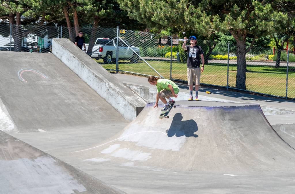 Sequim Gazette photo by Emily Matthiessen / On Saturday at the the Carrie Blake Skatepark, Gunnar Peterson works on a trick. Peterson was one of approximately 200 people who showed up to skate, scooter, bike and support the Sequim Youth Skatepark Foundations fundraiser. The Foundation seeks to rebuild and add on to the skatepark, with a goal of $1,000,000 and $20,000 raised so far.