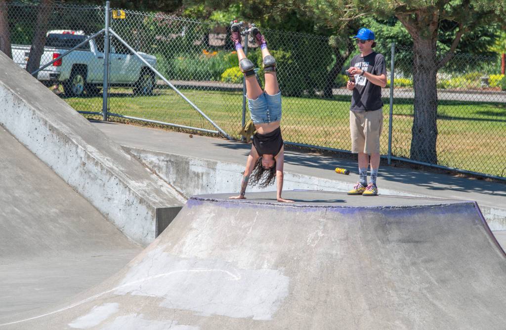 Jes Broder played, competed and did tricks at Sequim Youth Skatepark Foundations Saturday fundraiser at Carrie Blake Skate Park. Broder can roll up a slope and flip herself into a handstand with her skates above her. The skatepark welcomes many different types of wheels, from skateboards to bikes. Sequim Gazette photo by Emily Matthiessen