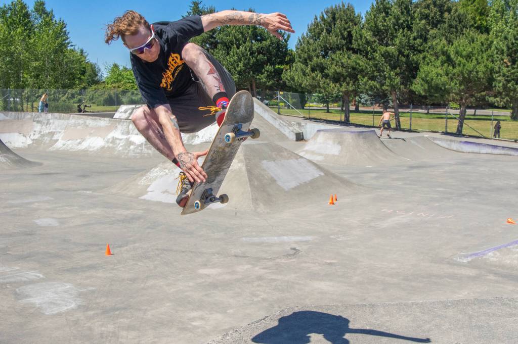 Sequim Gazette photo by Emily Matthiessen/ Aaron Schultz skates the park during Saturdays fundraiser for the Carrie Blake Park held by the Sequim Youth Skatepark Foundation. Schultz has been skating for 28 years. He said, I like to encourage the littles to try hard… if they fall, to get up and try again.
