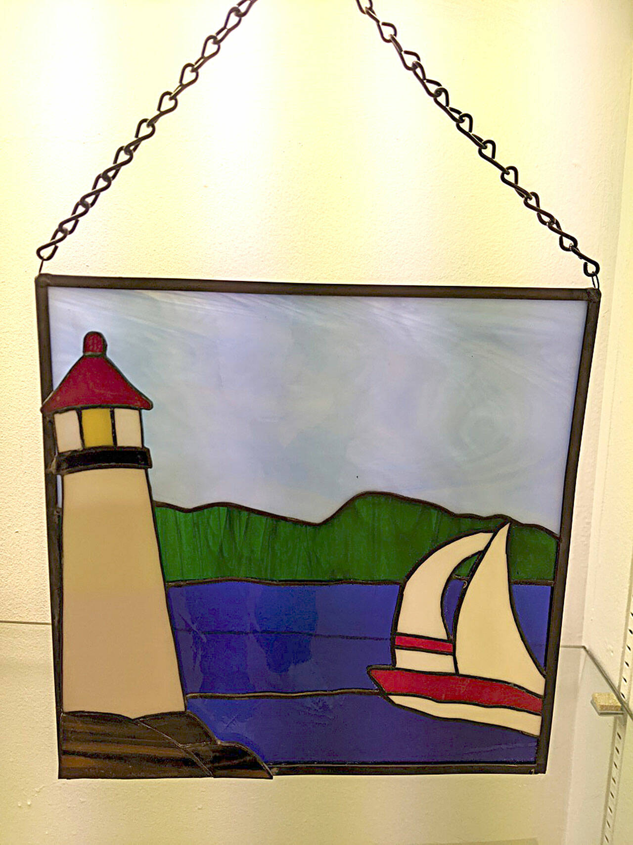 Submitted photo
June Echternkamp is one of the featured artists at the Blue Whole Gallery in July. Sailing, a stained glass work, is one of her many pieces on display.
