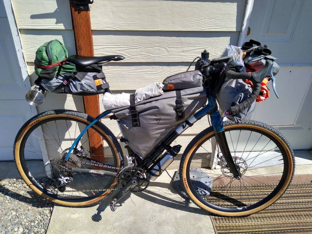 Being prepared with plenty of gear is key for successful bikepacking trips. Nate Van Laningham has numerous bags and packs that attach to the handlebar and frame, carrying food, water, tent, electronics, bike repair gear, extra clothes and other camping accessories. Photo by Nate Van Laningham