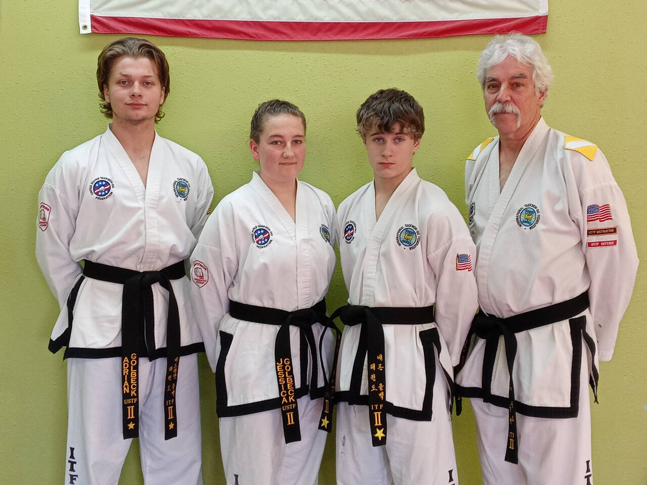 Submitted photo
The Golbeck family  from left, Adrian, Jessica, Aron and John  are each second degree black belts in Taekwon-do; Aron and Jessica passed their most recent tests in mid-May. Each are students at Sequims Bodystrong Taekwon-do Academy.