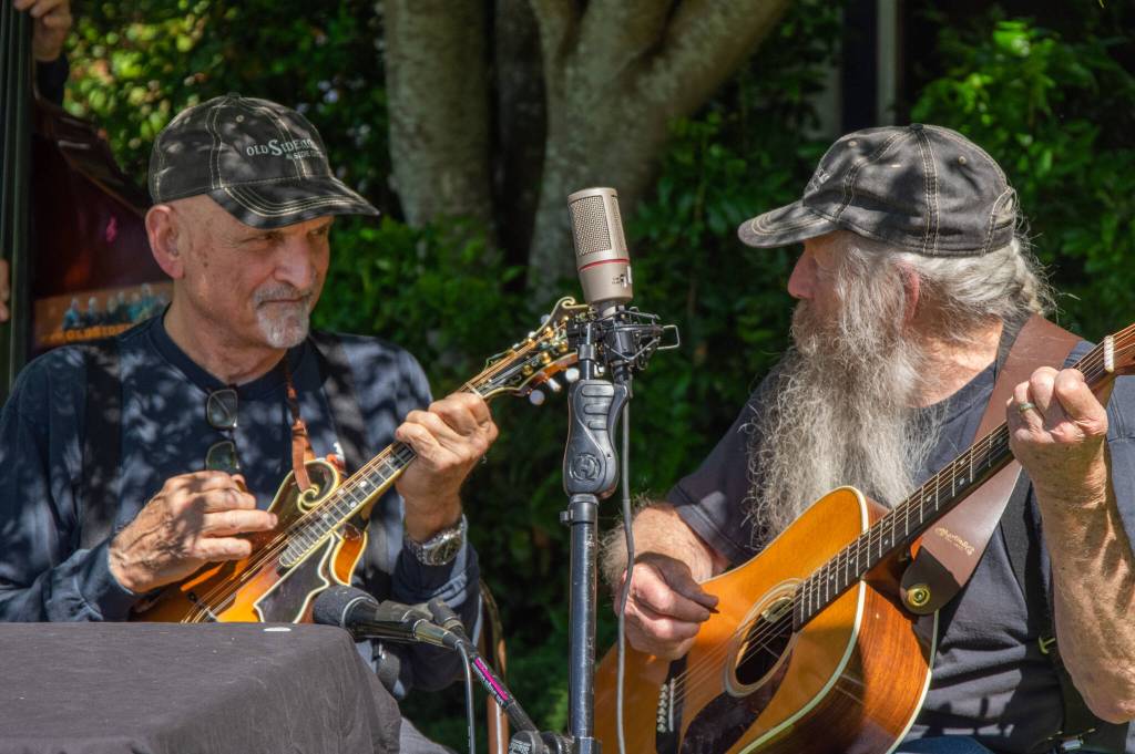 Sequim Gazette photo by Emily Matthiessen / Bill Camuso and Don Betts and the rest of the Old Sidekicks entertain the crowd at the 10th-annual Sequim Valley Lions Crab Feed at Pioneer Memorial Park on June 25.