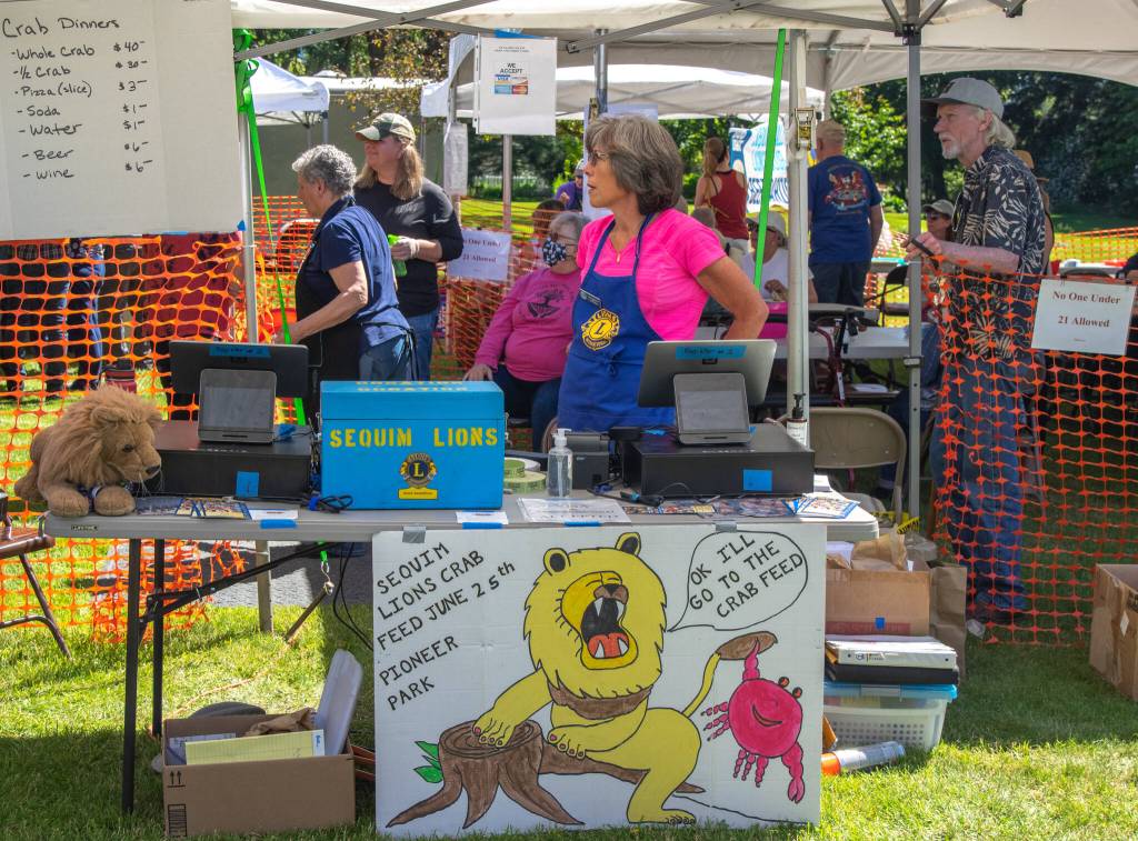"It's going really well," said Kim Romberg, volunteering at the Sequim Valley Lions 10th annual Crab Feed fundraiser on Saturday. "We're having a good turnout. The weather helped." Sequim Gazette photo by Emily Matthiessen