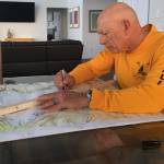 Photo by Carolyn DeSalvo
Frank DeSalvo, Sequim Bay Yacht Club commodore and co-chair of the clubs rowing and paddling fundraiser for Volunteer Hospice of Clallam County, outlines the new 8-kilometer course for the Sept. 17 race.