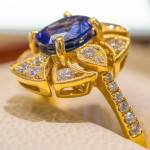 Sequim Gazette photo by Emily Matthiessen / A Ceylon sapphire, two carat, set in 18 carat yellow gold with diamonds is an example of a ring sold at Coles Jewelers, which Debbie Hunt and Libby Rogers re-opened this June on 117 E. Washington St.
