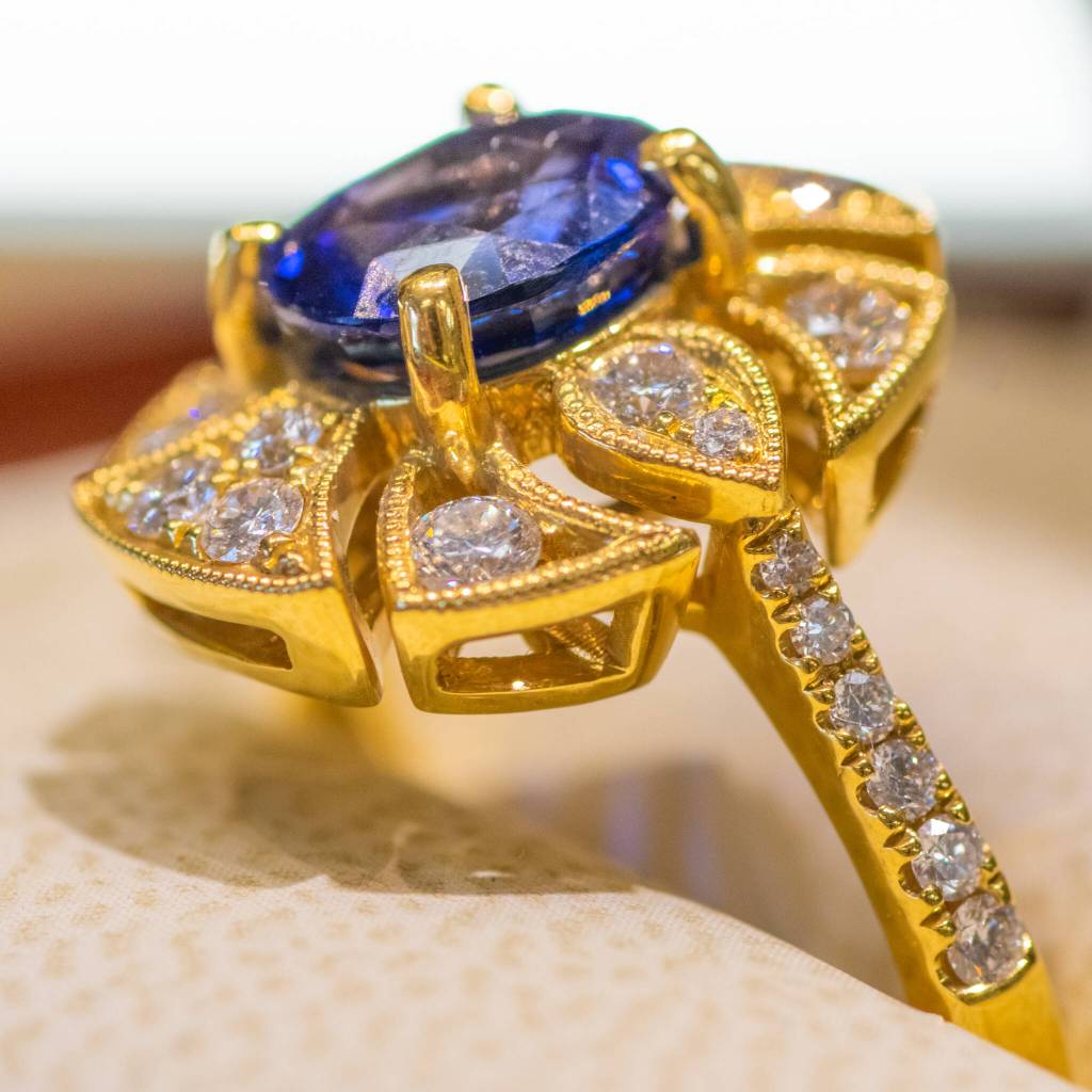 Sequim Gazette photo by Emily Matthiessen / A Ceylon sapphire, two carat, set in 18 carat yellow gold with diamonds is an example of a ring sold at Coles Jewelers, which Debbie Hunt and Libby Rogers re-opened this June on 117 E. Washington St.