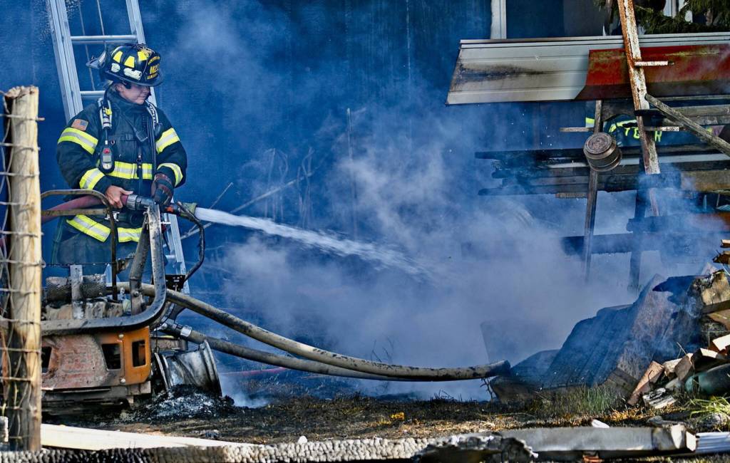 Photo by Jay Cline/Fire District 2 / Firefighters work to help put out a fire at an Agnew property on June 30.