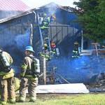 Photo by Jay Cline/Fire District 2 / Firefighters work to help put out a fire at an Agnew property on June 30.