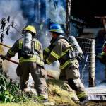 Photo by Jay Cline/Fire District 2 / Firefighters work to help put out a fire at an Agnew property on June 30.