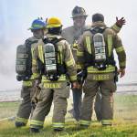 Photo by Jay Cline/Fire District 2 / Fire District 3 chief Ben Andrews talks with firefighters at a structure fire in Agnew on June 30.