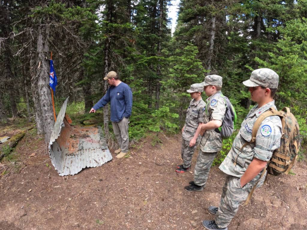Submitted photo / Dungeness Composite Squadron Captain Nick Sue explains to squadron cadets how a piece of the wreckage was originally part of the aircraft.