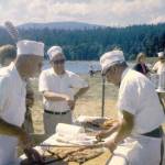 Submitted photo / Bob Thompson two others serve at Sequims first Salmon Bake, held 53 years ago (1969) at Pit Ship Point, now home to John Wayne Marina.