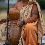 Sequim Gazette photo by Emily Matthiessen / An audience in the field behind the Sequim library on July 16 is treated to a talk covering many aspects of Hawaiian traditional culture and history, including details about the instrument called an Ipu by Candace Marie Kananiokamokihana Melendez, who began her formal training in hula at age 5. She and her daughter visited the libraries of the North Olympic Library system as part of their summer reading program.
