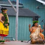 Sequim Gazette photo by Emily Matthiessen / Kumu Hula Mokihana Melendez of Hālau Hula Ka Lei Mokihana I Ka Ua Noe, shares wisdom, history and language with an audience behind the Sequim Library on July 16 as part of the North Olympic Librarys summer reading program. She began her formal training in hula at the age of five. Her daughter and featured dancer Alakai Makana Caro listens to her left.