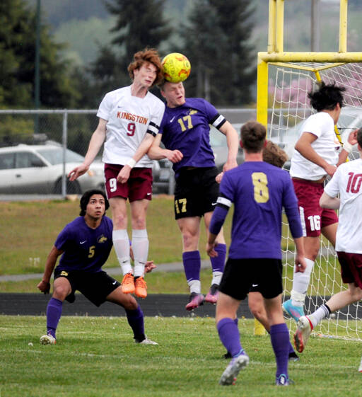 Sequim Gazette file photo by Michael Dashiell
Aidan Henninger, right, pictured vying for a header with a Kingston defender during a game in April, was named 2022 All-Peninsula Boys Soccer Team co-MVP, along with SHS teammate Brandon Wagner.