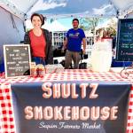 Photo by Emma Jane Garcia/Sequim Farmers & Artisans Market / Alexis Lobdell and Steve Shultz offer Kansas City-styled, slow-cooked meats, tangy and spicy sauces, and more at their Sequim Farmers & Artisans Market booth.
