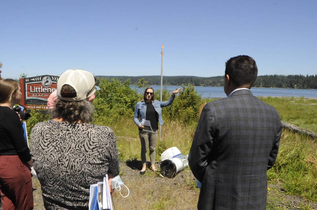 Sequim Gazette photo by Matthew Nash/ Liz Tobin, shellfish program manager for the Jamestown SKlallam Tribe, speaks to a small crowd at Littleneck Beach in Blyn on July 19 about restoration efforts in the area. The U.S. Environmental Protection Agency just announced a $50 million grant over five years to help many treaty tribes, including Jamestown, with salmon and shellfish habitat restoration efforts.