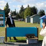 Darlene Clemens snaps a photo of her husband Michael on Sunday, Oct. 10 at the Little Free Pantry in Agnew. He has built many of the pantries in Port Angeles and Sequim, and said he likes to build things and the pantries are right up my alley. Sequim Gazette photo by Matthew Nash