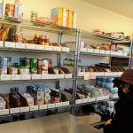 Diane Hill-Dwyer takes a tour inside the Olympic Unitarian Universalist Fellowships Florence and Michael Bucierka Social Justice Building on Oct. 10. The fellowship opened a free pantry almost a year ago and volunteers felt the need to expand its offerings leading them to construct the expansion for storage and other projects. Sequim Gazette photo by Matthew Nash