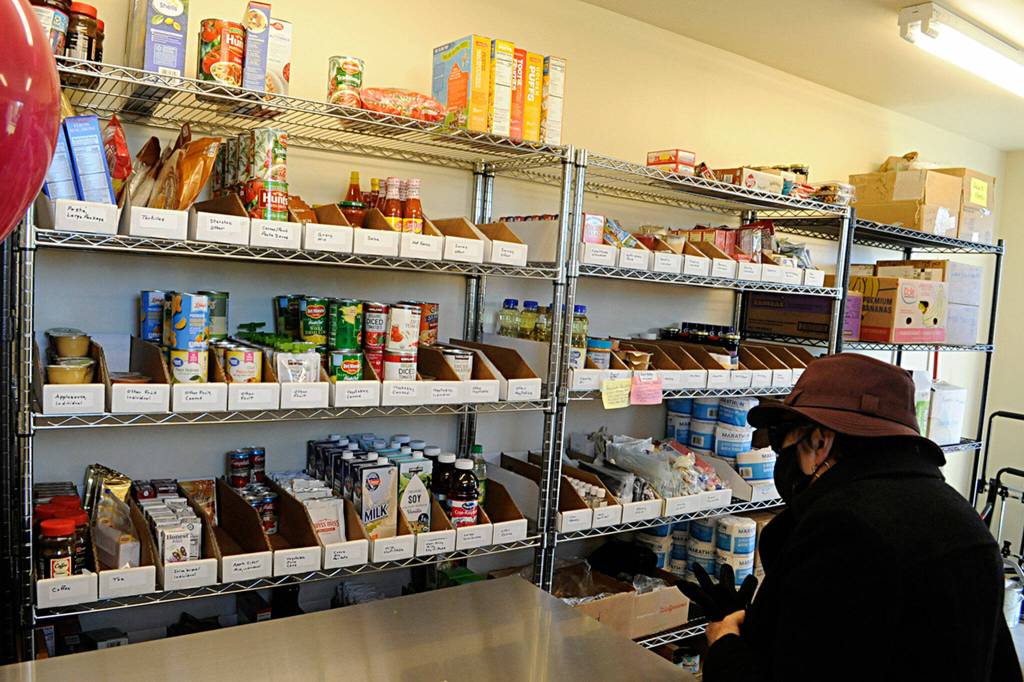 Diane Hill-Dwyer takes a tour inside the Olympic Unitarian Universalist Fellowships Florence and Michael Bucierka Social Justice Building on Oct. 10. The fellowship opened a free pantry almost a year ago and volunteers felt the need to expand its offerings leading them to construct the expansion for storage and other projects. Sequim Gazette photo by Matthew Nash