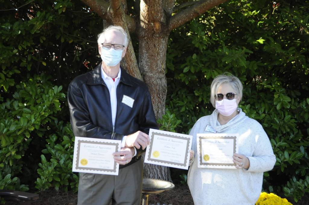 Community partners Michael Clemens, who built the Little Free Pantry and the extension, and Andra Smith, executive director for the Sequim Food Bank. Sequim Gazette photo by Matthew Nash