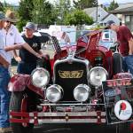 Sequim Gazette file photo by Michael Dashiell
Wayne Caldwell of Sequim, second from left, discusses his Stutz sports car, a 1927 AA Black-Hawk boat-tail two-passenger speedster, with attendees of the Sequim Prairie Nights event in downtown Sequim in 2021.