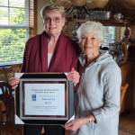 Submitted photo
Soroptimist International member Paulette Hill, right, accepts her Woman of Distinction Award from club president Cat Xander.