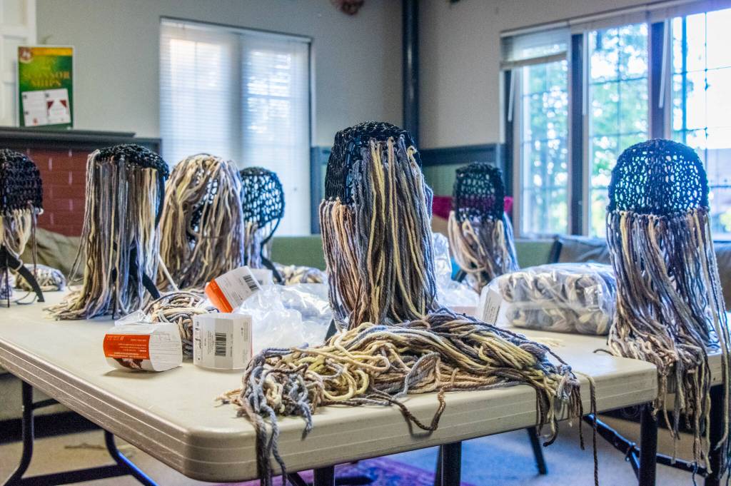 Sequim Gazette photo by Emily Matthiessen / The 13 dwarves in The Hobbit, Olympic Theatre Arts play scheduled to run Aug. 5-14, are played by actors of diverse characteristics, but they all need wigs and beards. We made some in a workshop and those folks have been teaching the others how to make them during rehearsal, director Marissa Meek said.