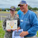 Submitted photo
Paige Biss celebrates EAA Chapter 430s 4,000th Young Eagle flight with pilot Gordon Tubesing.